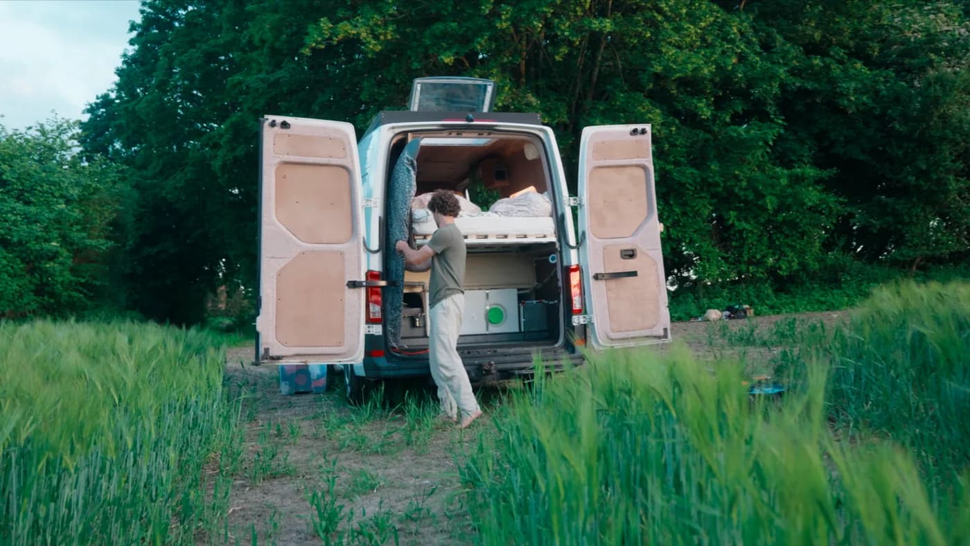 The rear doors open showing the garage under the bed